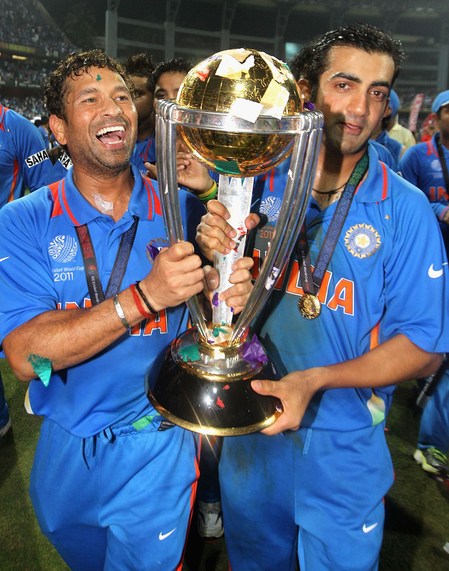 Sachin Tendulkar and Gautam Gambhir walk with the trophy 